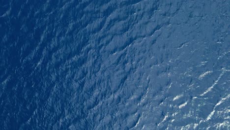 Drone-top-down-bird's-eye-view-of-ripples-in-Caribbean-ocean-water-as-currents-flow