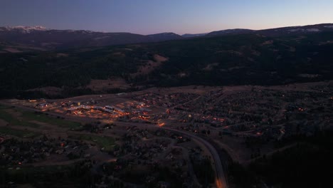 Night-drone-flyover-of-big-sky,-montana-golf-course-and-hotels