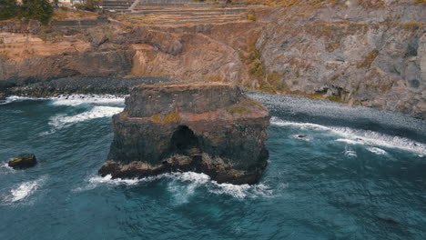 Los-Roques-Beach,-Tenerife:-flying-towards-the-volcanic-rock-formation-on-the-island-of-Tenerife