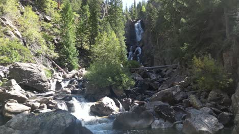 Creek-Waterfall-Aerial-smooth-canyon-flyover,-Fish-Creek-Falls-near-Steamboat-Springs