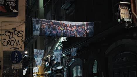 Naples-alley-adorned-with-football-team-banners,-Italy
