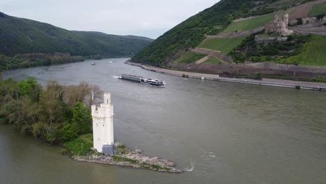 Cruise-ship-navigating-on-river-Rhine-amid-german-castle-scenery