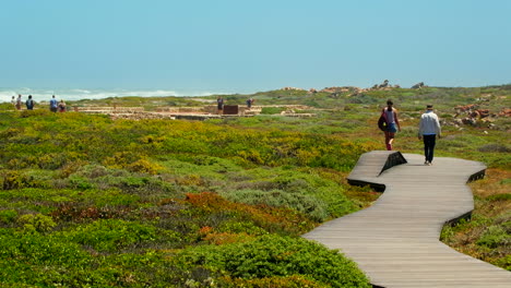 Tourists-visiting-Southern-Tip-Monument-in-Agulhas-National-Park,-South-Africa