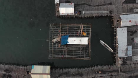 Top-down-view-of-local-fishing-boat-at-Belitung-island-Indonesia,-aerial
