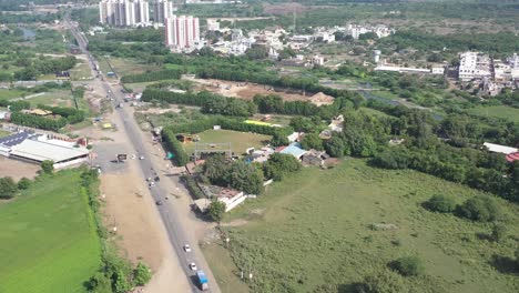 RAJKOT-CITY-AERIAL-VIEW-Drone-camera-moving-forward-showing-a-large-party-plot-I-have-surrounded-the-party-plot-with-huge-bushes