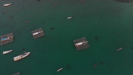 Top-down-view-of-traditional-fishing-boats-at-Belitung-island-Indonesia,-aerial