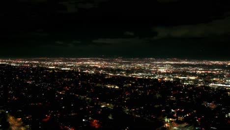 High-elevation-drone-shot-of-Salt-Lake-City,-Utah-suburbs-at-night
