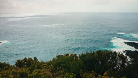 Slow-motion-wide-shot-of-rocky-coastline-from-high-viewpoint