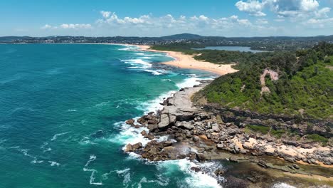 From-Terrigal-to-Spoon-Bay:-An-Aerial-Journey-Over-Wamberal-Beach,-Highlighting-the-Central-Coast's-Pristine-Nature-Reserve,-Australia