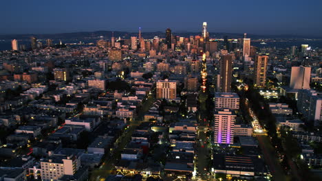 Hyperlapse-drone-shot-backwards-over-the-cityscape-of-San-Francisco,-sunset-in-USA