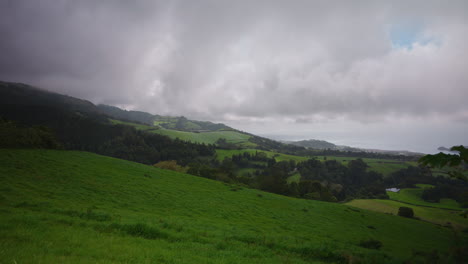 Panoramic-view-of-green-lush-meadow-landscape-in-the-Azores,-Cloudy-dramatic-weather