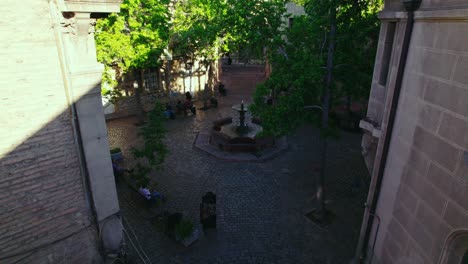 Slow-dolly-shot-showing-people-sitting-at-the-Freedom-of-the-Press-Square-in-Chile