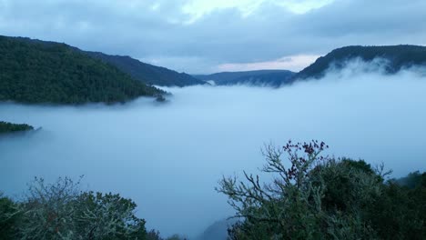 Low-Light-Drone-Footage-Of-Sil-Canyon-Covered-With-Dense-Fog,-Galicia-Spain