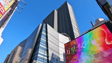 looking-up-the-skycrapers-with-billabords-in-Shinjuku