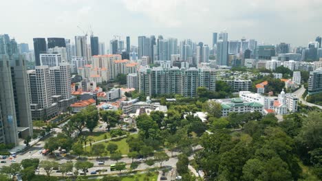 Singapore-downtown-park-morning-skyline-drone-establishment-shot,-bright-weather,-aerial-view