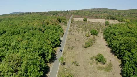 Zipline-drone-shot-of-a-highway-in-a-scenic-countryside-in-Bulgaria