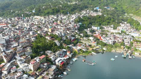 High-angle-static-view-above-Lake-Atitlan-Guatemala-city-and-apartment-homes