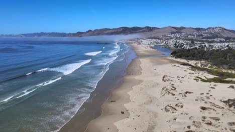 Coastal-Transition:-From-Pismo-Beach-to-North-Beach-Campground,-Glide-along-the-stunning-coastline-in-this-seamless-pan-from-Pismo-Beach-to-the-serene-North-Beach-Campground