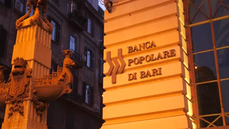 Banca-Popolare-di-Bari-Bank-Name-Sign-On-The-Wall-In-Naples,-Italy