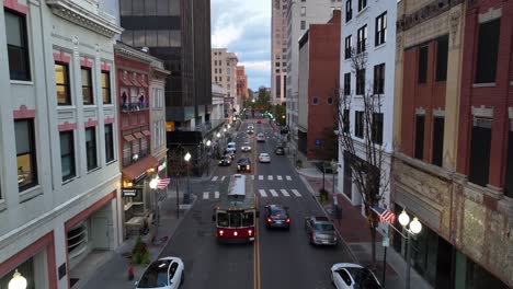 Downtown-street-with-historic-buildings-and-a-trolley-at-dawn