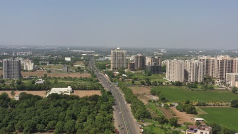 RAJKOT-CITY-AERIAL-VIEW-Drone-camera-moving-towards-a-high-rise-palace-near-Kalavd-Road