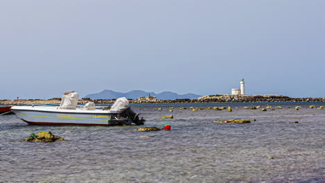 Boat-Docked-On-The-Shore-Of-Trapani-In-Sicily,-Italy