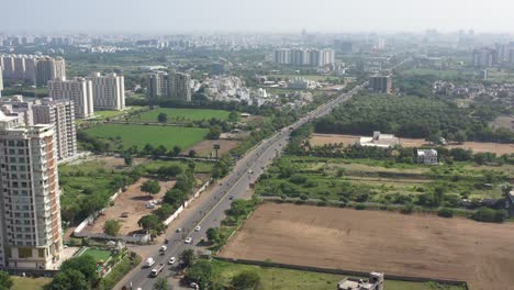 RAJKOT-CITY-AERIAL-VIEW-A-PARTY-PLOT-AND-LOW-RISE-HOUSES-VIEWED-FROM-KALAWAD-ROAD-AMONG-MANY-HUGE-HUGE-TREES