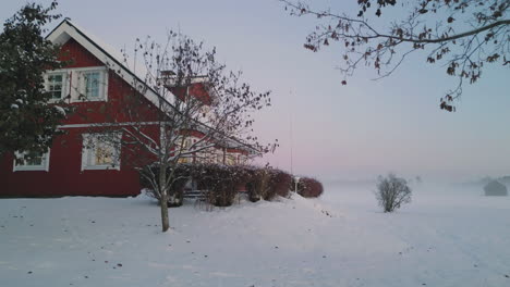 Cozy-wooden-Nordic-home-in-winter-season,-dolly-forward-view