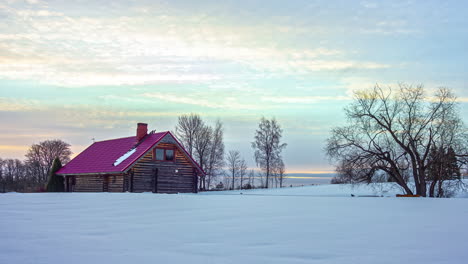 A-Twilight-To-Daylight-Time-Lapse-Shot-Of-A-Lonely-Woodhouse-In-The-Snow