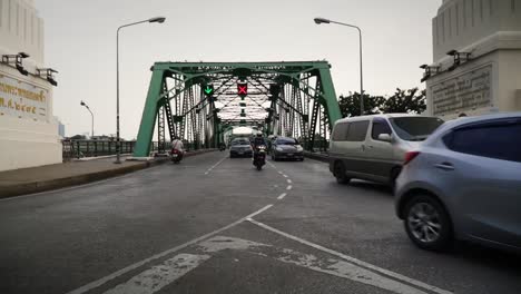 Female-Backpacker,-Tourist,-Traveler-Taking-Photos-On-The-Street-Corner-Of-A-Famous-Memorial-Bridge-In-Bangkok-Thailand