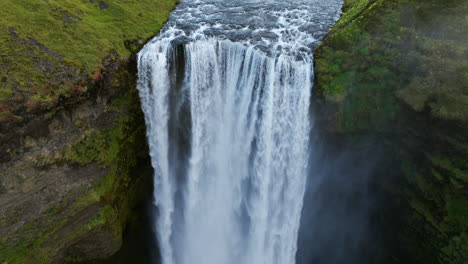 Waterfall-Skogafoss-In-Scenic-Nature-Landscape-In-Iceland---Aerial-Drone-shot