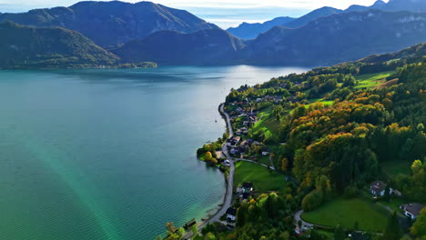 Beautiful-Aerial-countryside-view-of-Attersee-Lake,-Salzkammergut,-and-the-Alps-mountains-from-Unterach