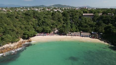 Aerial-Drone-Zoom-In-Carrizalillo-Puerto-Escondido-Blue-Lagoon-Beach-Mexico-Travel-and-Tourism,-Mexican-Summer,-Skyline-and-Nature