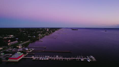 A-tranquil-morning-at-Sebastian's-Yacht-Club,-captured-in-a-serene-aerial-sunrise,-exuding-marine-elegance-and-coastal-charm