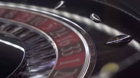 Close-up-shot-of-a-spinning-casino-roulette-wheel-showing-the-lucky-ball-landing-on-a-random-number