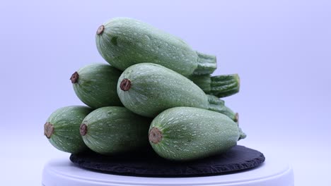 Fresh-green-zucchini-rotating-on-a-turntable
