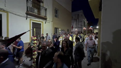 Catholic-parade-procession-at-nighttime-in-Seville,-Spain