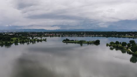 Drone-shot-over-a-glassy-smooth-Sloan's-Lake-with-Penny-Island-sitting-in-the-middle-of-the-calm-water