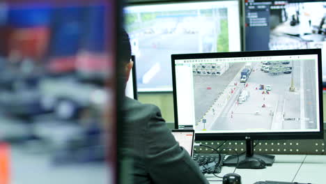 general-shot-of-male-security-guard-in-surveillance-room