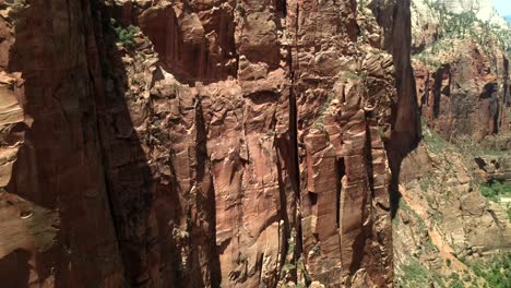 Drone-footage-provides-an-intense,-up-close-view-of-the-rock-wall-in-Zion-National-Park