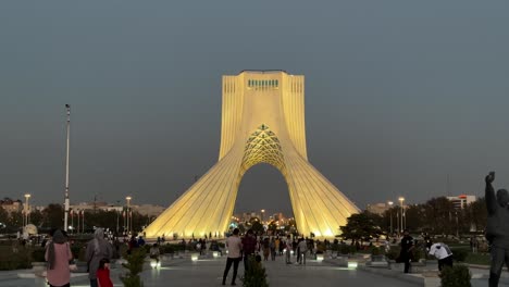 Travelers-are-visiting-Tehran-landmark-in-Iran-Azadi-tower-freedom-square-Shahyad-landmark-in-city-center-down-town-old-city-in-middle-east-asia-at-night-twilight-dawn-dusk-evening-sunset-landscape