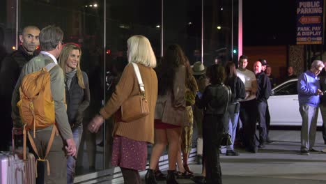 people-standing-outside-of-hotel