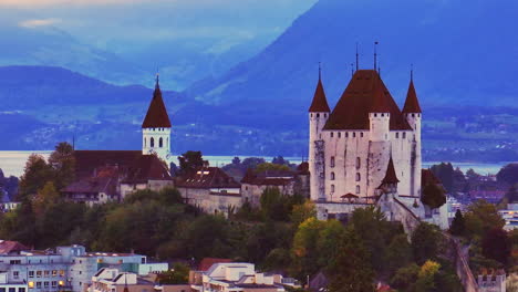 Aerial-cinematic-drone-downtown-Thun-Switzerland-cars-Swiss-village-city-downtown-stunning-Thun-Castle-Dukes-of-Zährigen-Interlocken-Bern-Jungfrau-cloudy-sunrise-sunset-circle-right-parallax-movement
