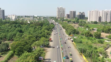 RAJKOT-CITY-AERIAL-VIEW-Inside-Rajkot-City-there-is-a-road-between-dense-trees