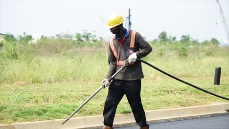Process-of-asphalting-road-construction-infrastructure-by-cleaning-the-surface-layer-with-an-air-compressor-to-remove-adhering-dust-before-spreading-the-asphalt