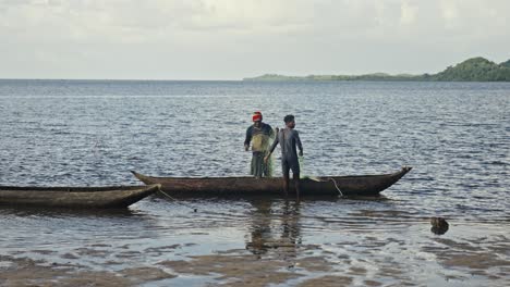 Fishermen-work-with-fishing-nets-on-shore