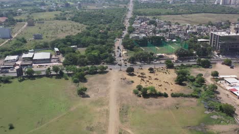 RAJKOT-CITY-AERIAL-VIEW-Drone-camera-going-over-Kalavad-Road-where-there-are-many-dangerous-four-wheel-bike-rickshaws