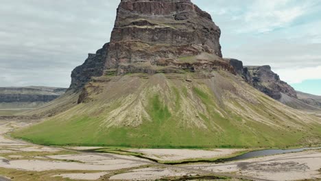 Road-Number-1-And-The-Lomagnupur-Mountain-In-South-Iceland---Aerial-Pullback