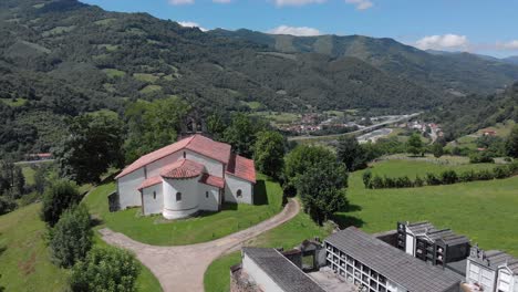 Aerial-Drone-Landscape-of-Romanesque-Church-San-Vicente-de-Serapio-in-Asturias-with-Clear-Skyline