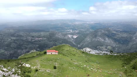 Aerial-Drone-Fly-Above-Monsacro-Chapel-Skyline-Landscape,-Aramo-Asturias-Hills-Peaceful-Environment
